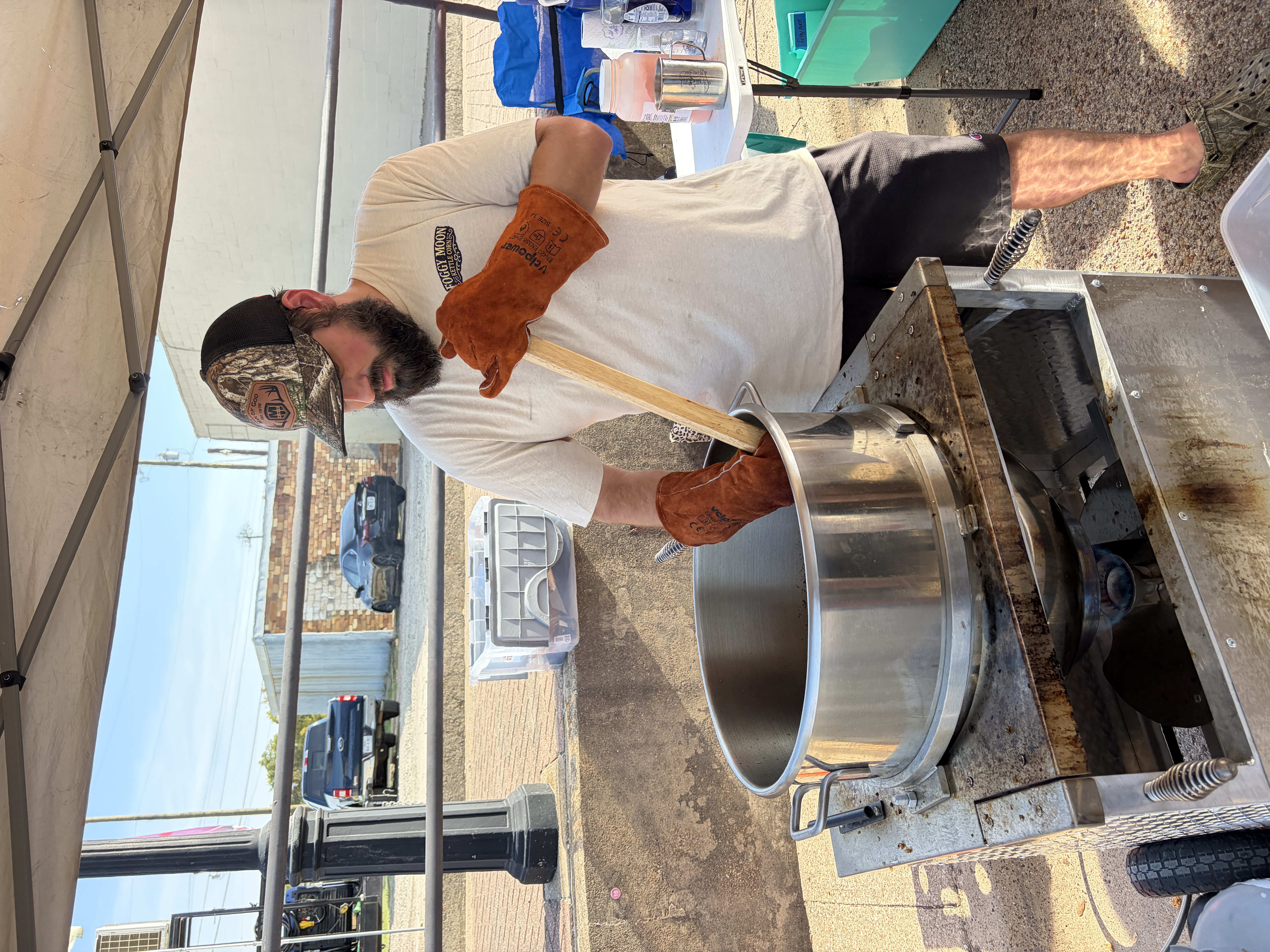 Hand-stirring a fresh batch of Foggy Moon kettle corn